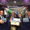 Happy Shetlanders after prestentation of the prestigous prize. l-r Gary Robinson, Shetland Islands Council Political Leader, Allan White, Architect who designed all the Centres, Joe Irvine, Chairman Shetland Recreational Trust and James Johnston, General Manager Shetland Recreational Trust and Vice Chairman of the International Island Games Association